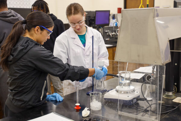 Two students in chemistry lab