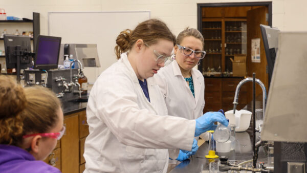 Chemistry students conducting experiment