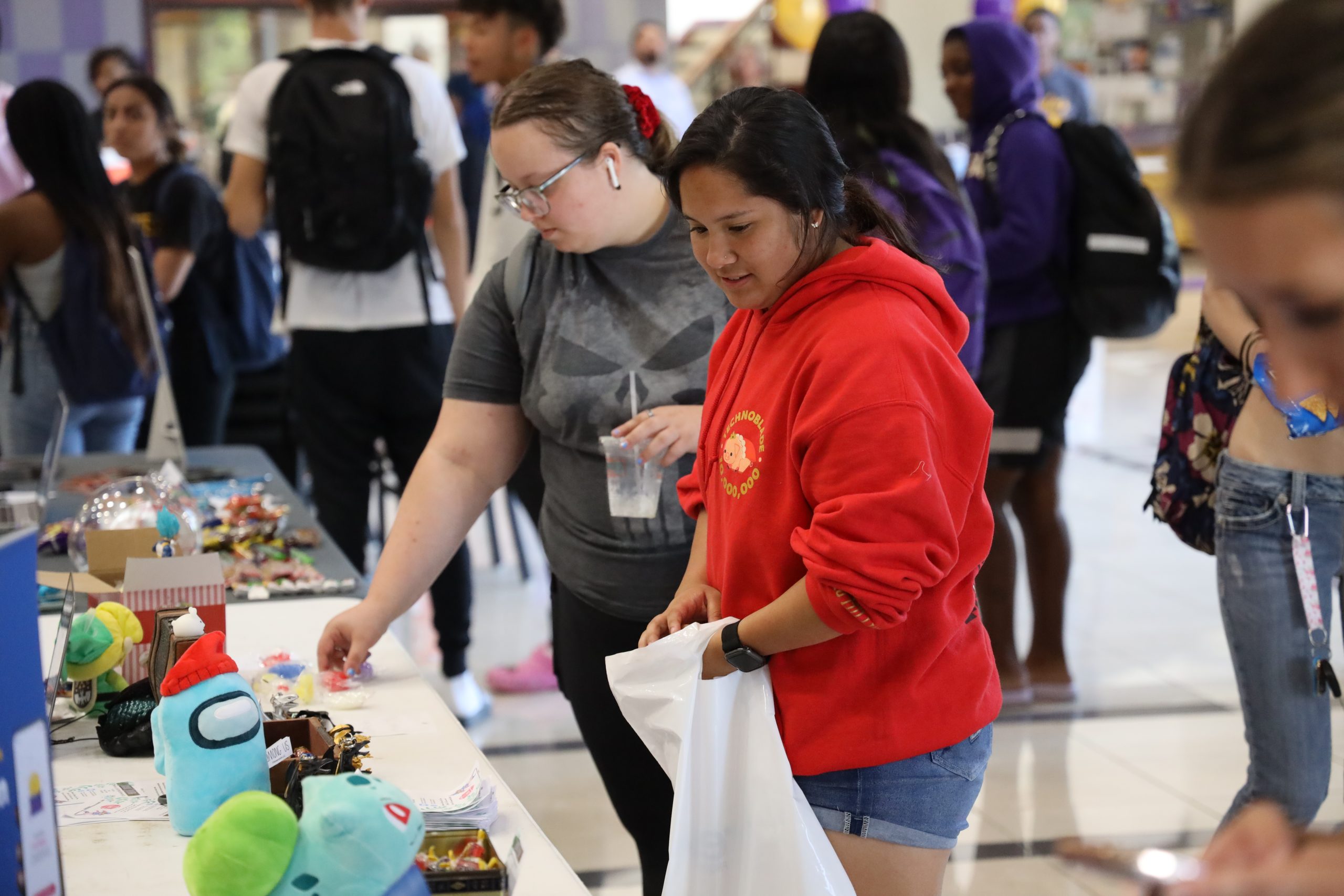 Tables and people interacting at fair