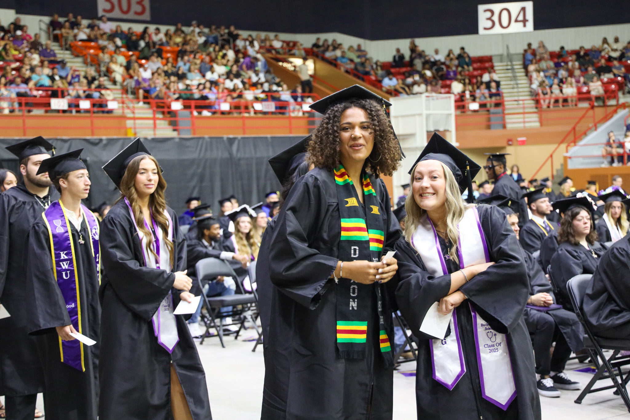 Students at graduation in cap and gown