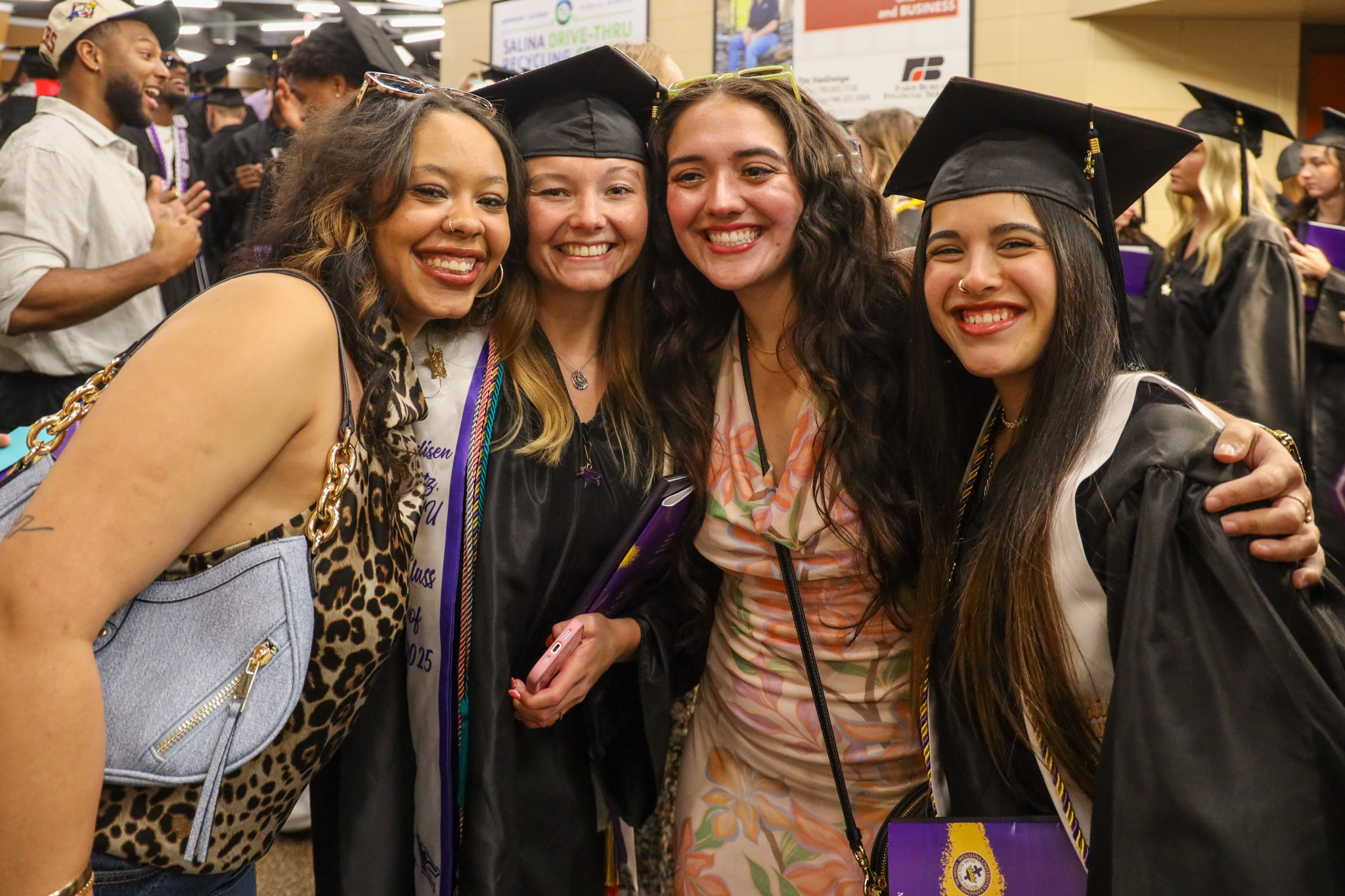 Four female students after graduation