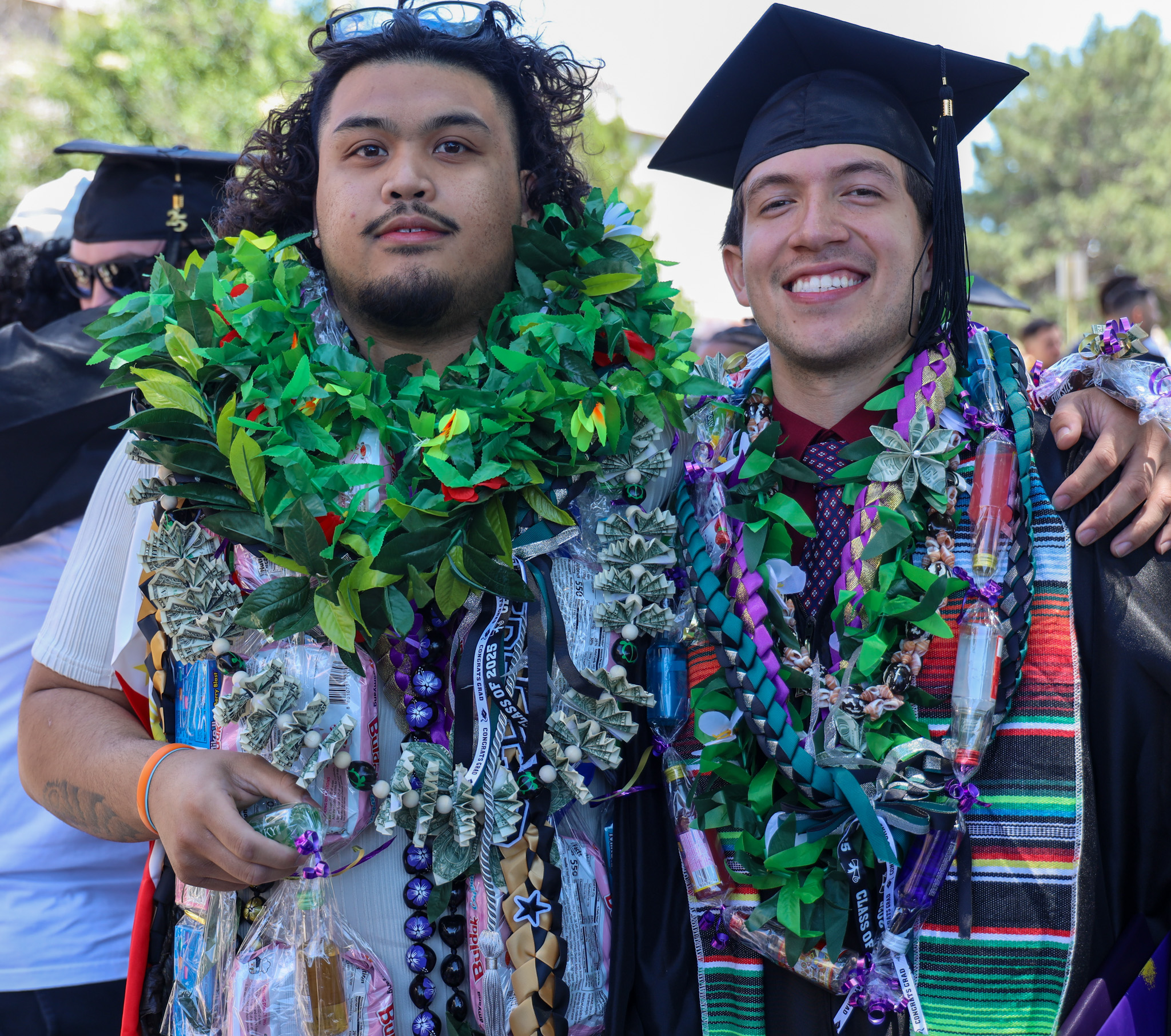 Celebrating two male students after graduation