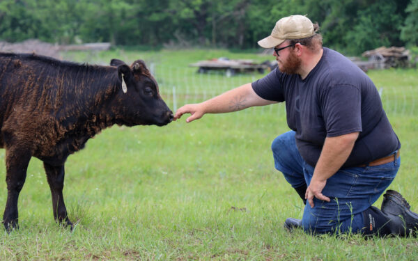 Farmer with cow