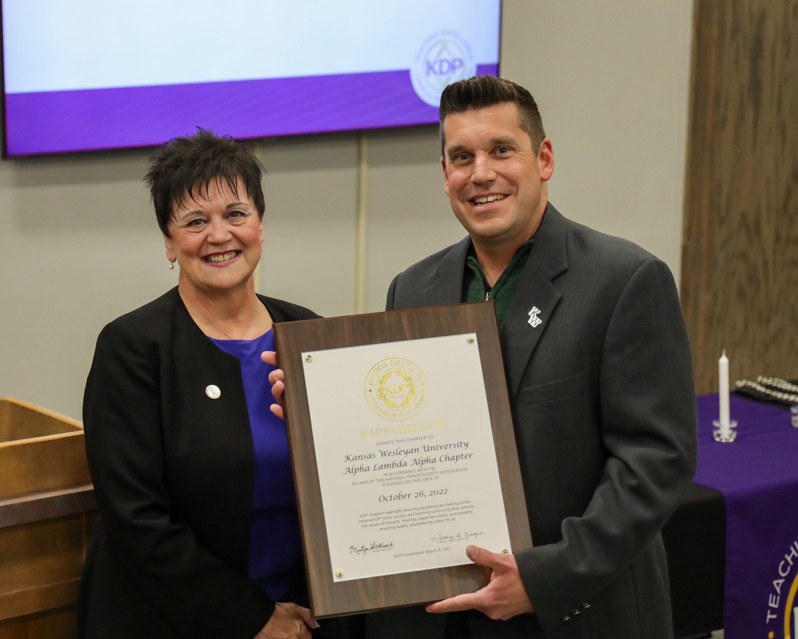 Man holding proclamation regarding education event