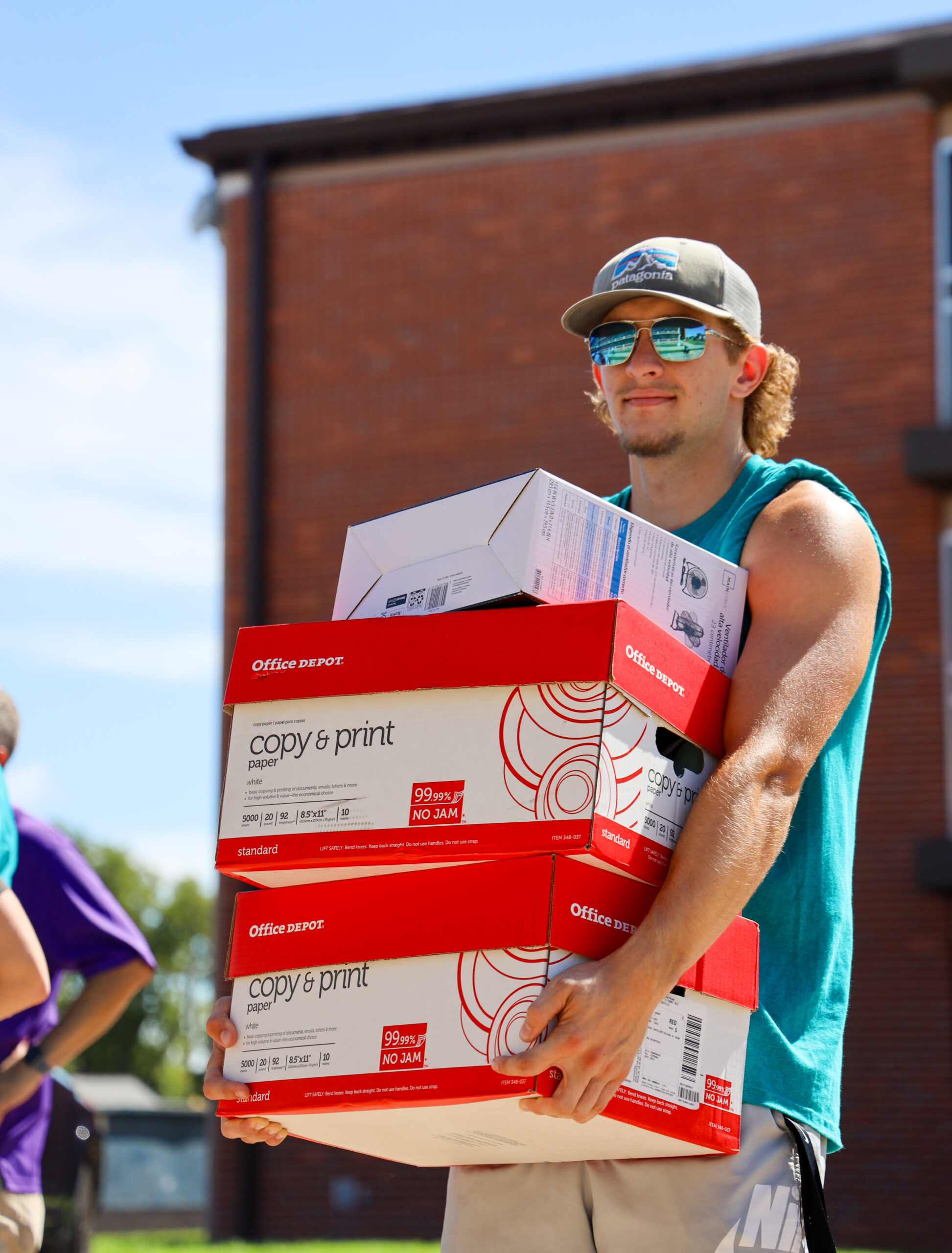 Student carrying large items at move-in