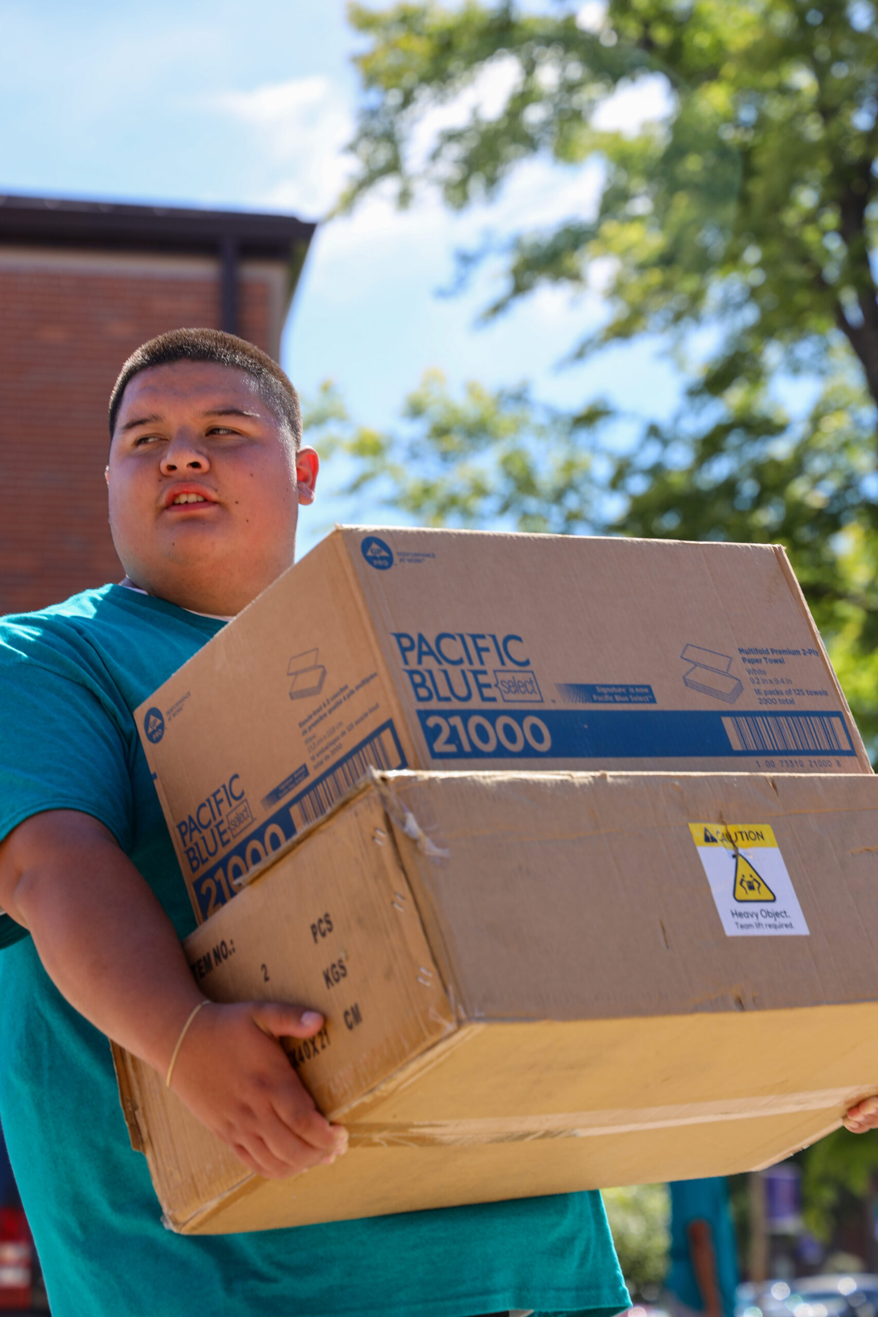 Student carrying large item at move-in