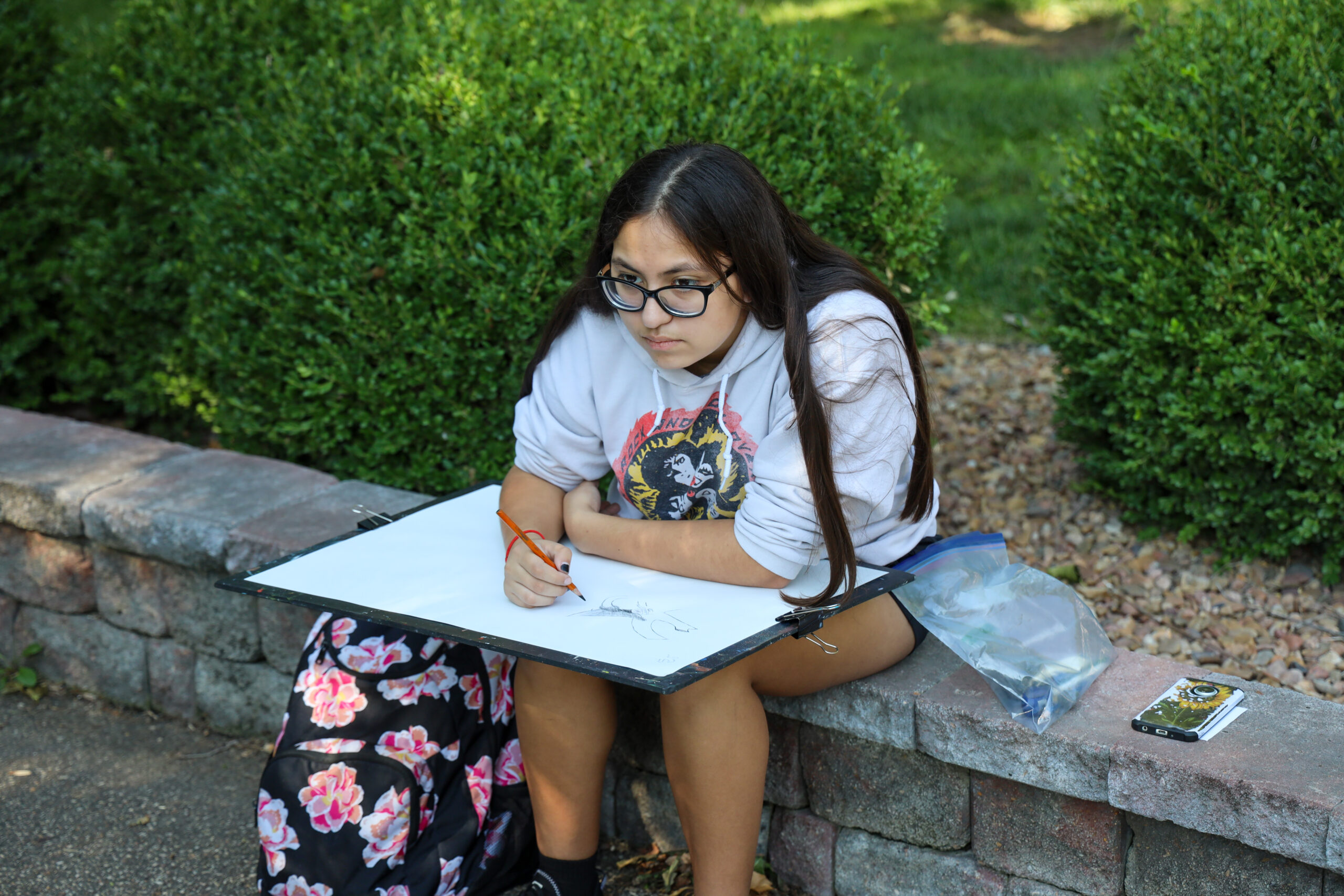 Student drawing outdoors