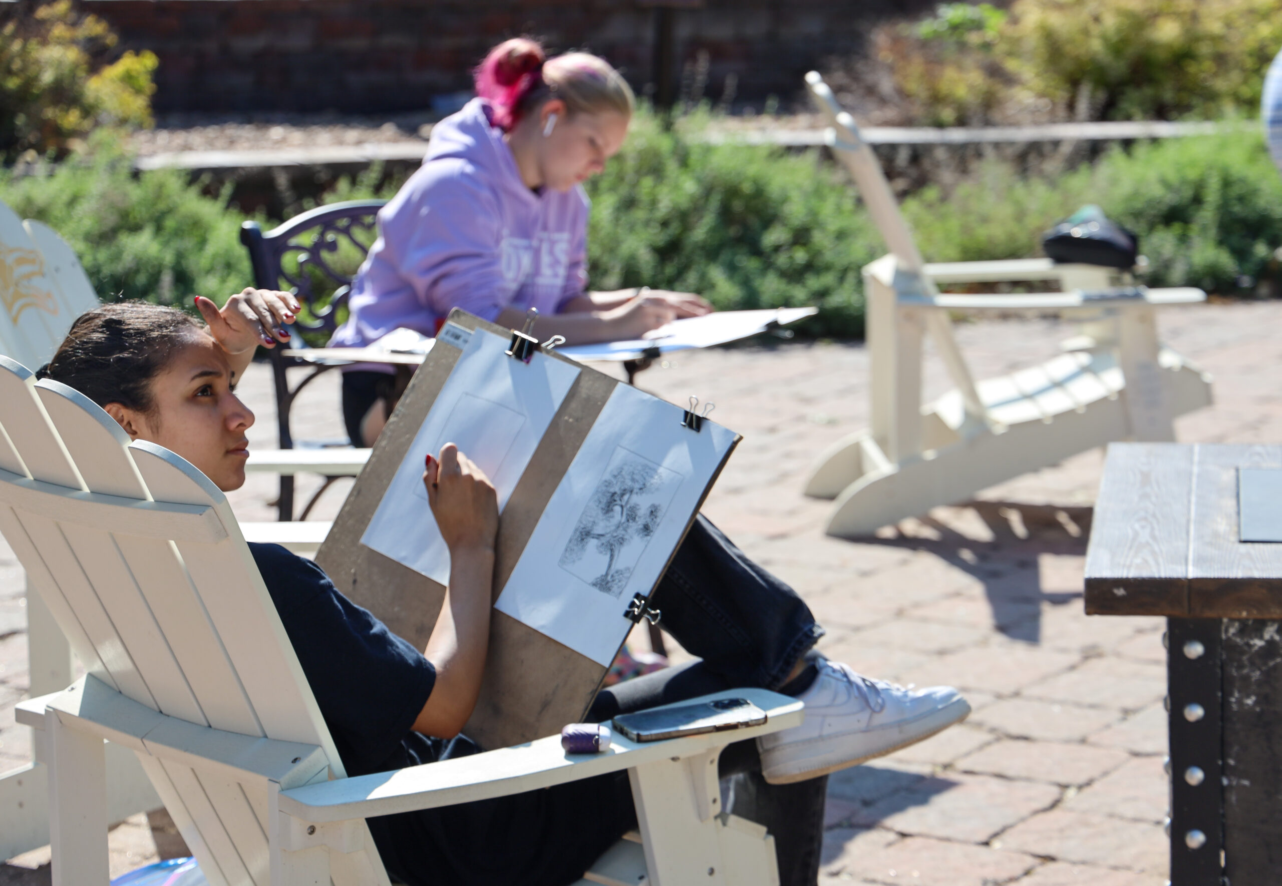 Student drawing outdoors