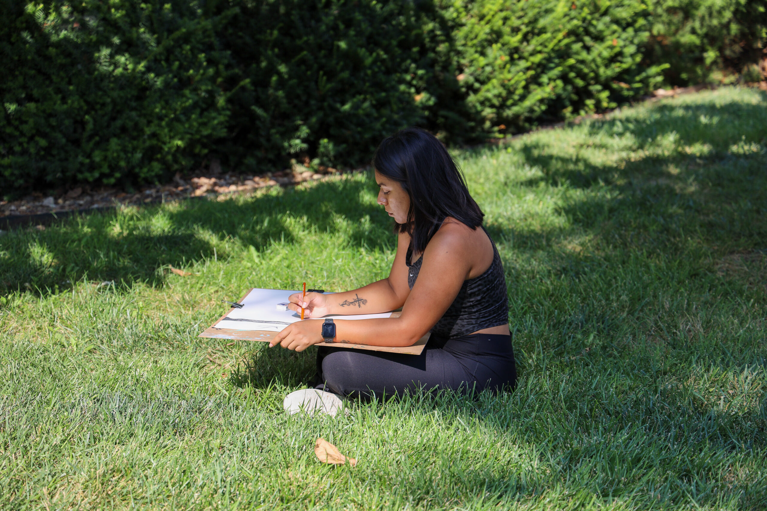 Student drawing outdoors