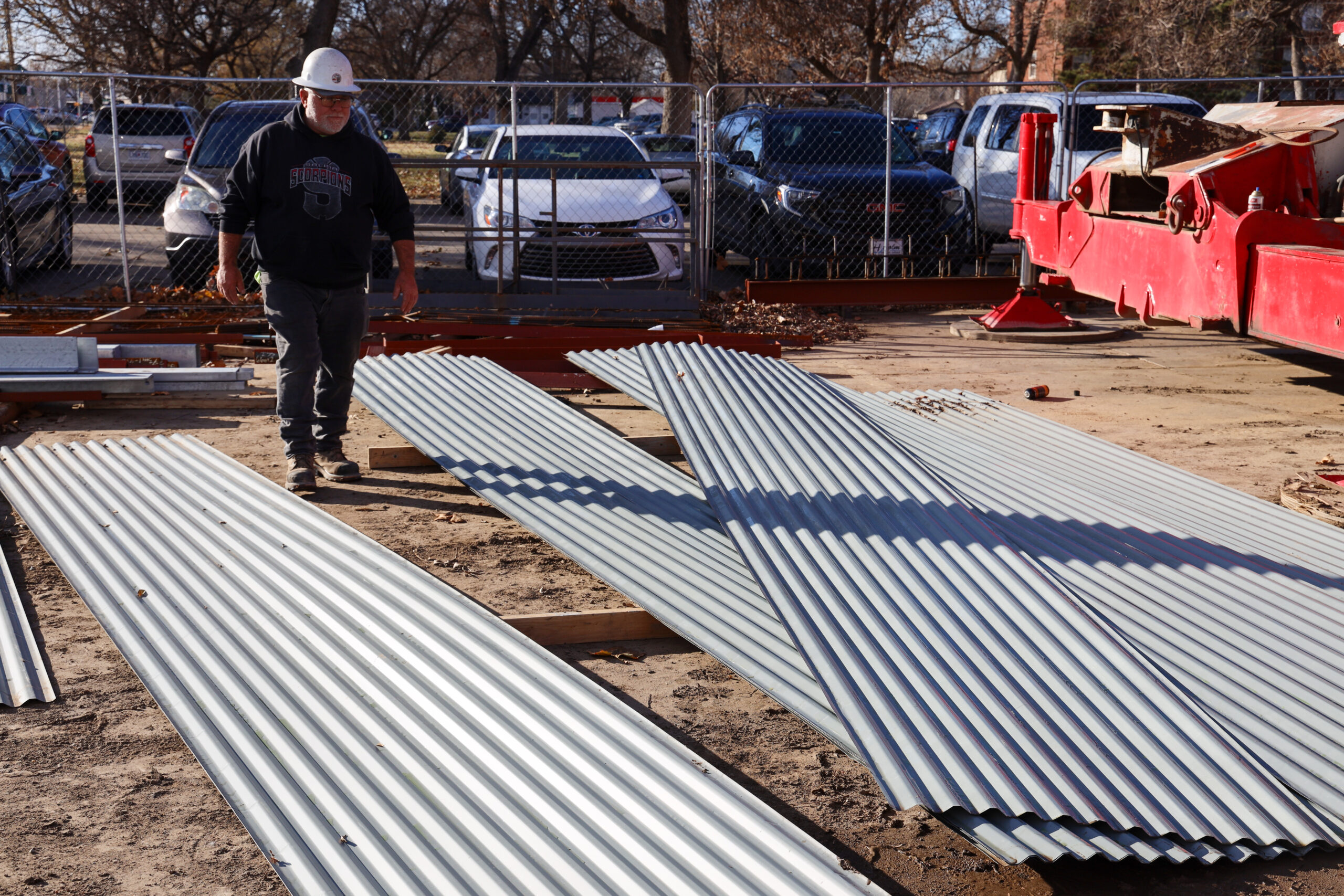 Man near Decking panels for Pioneer Hall's new entrance
