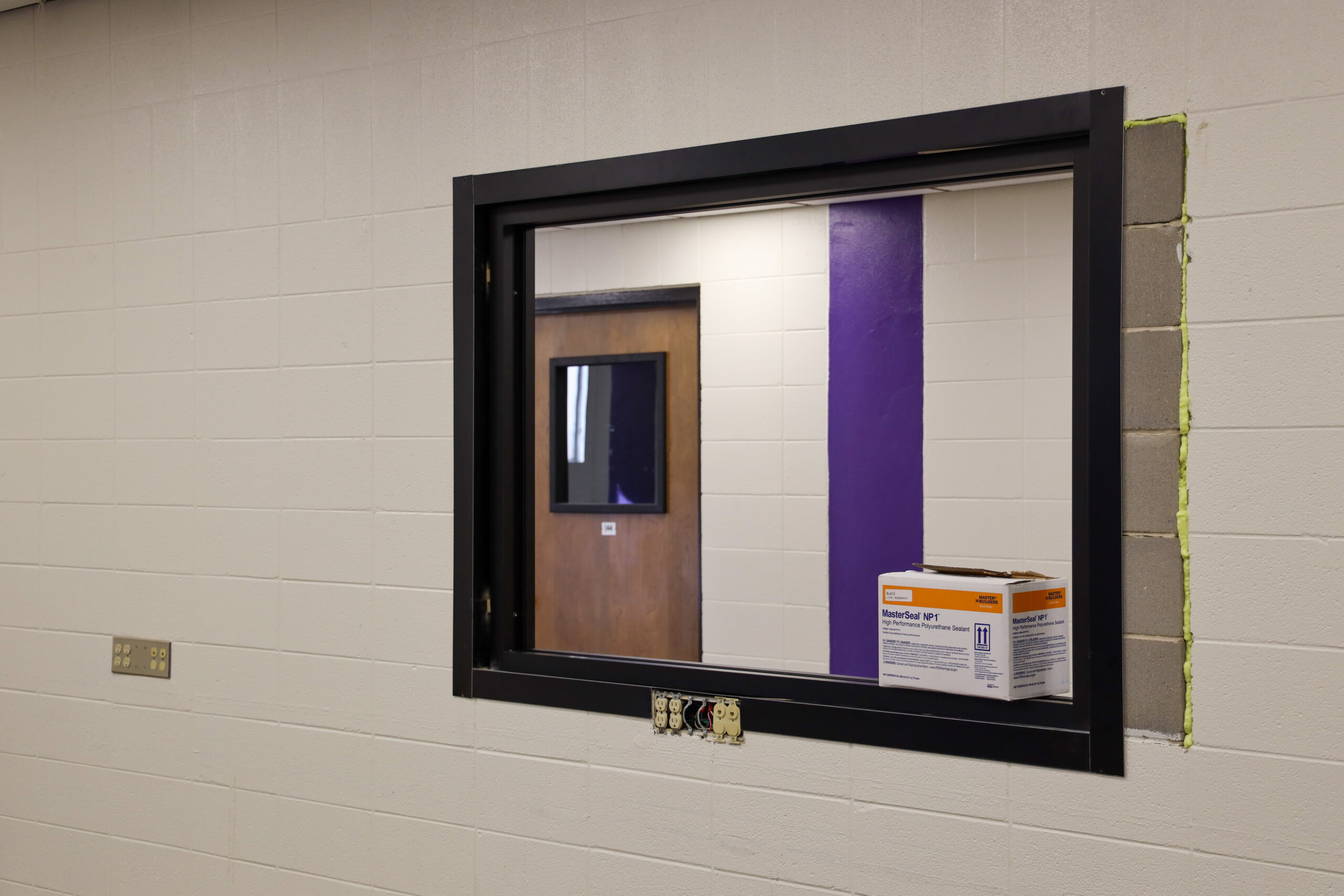 Looking out window into hallway outside Criminal Justice classroom