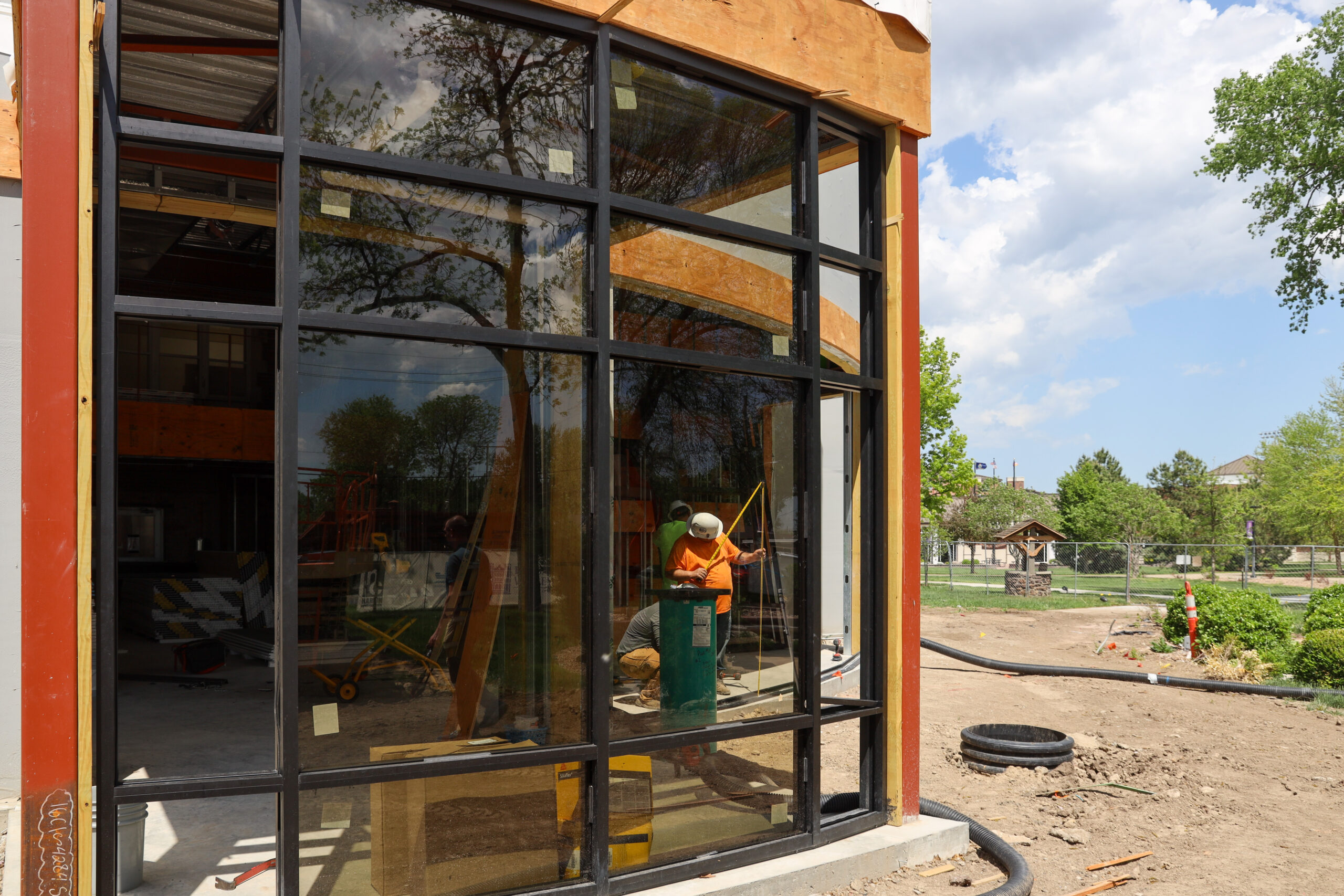 Glass being installed in front of Pioneer Hall