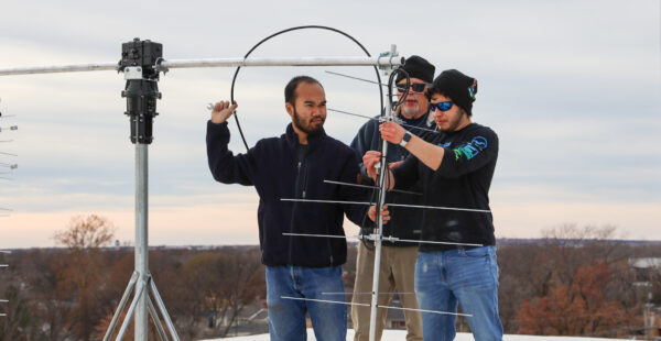 Students installing an antenna