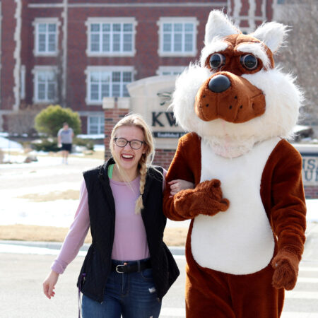 Casey the Coyote with a student