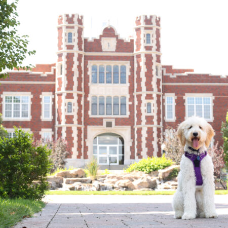 Ellie in front of Pioneer Hall