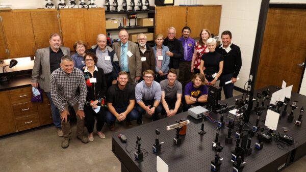 Group poses for dedication of Optics lab