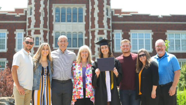 Student with family members at graduation