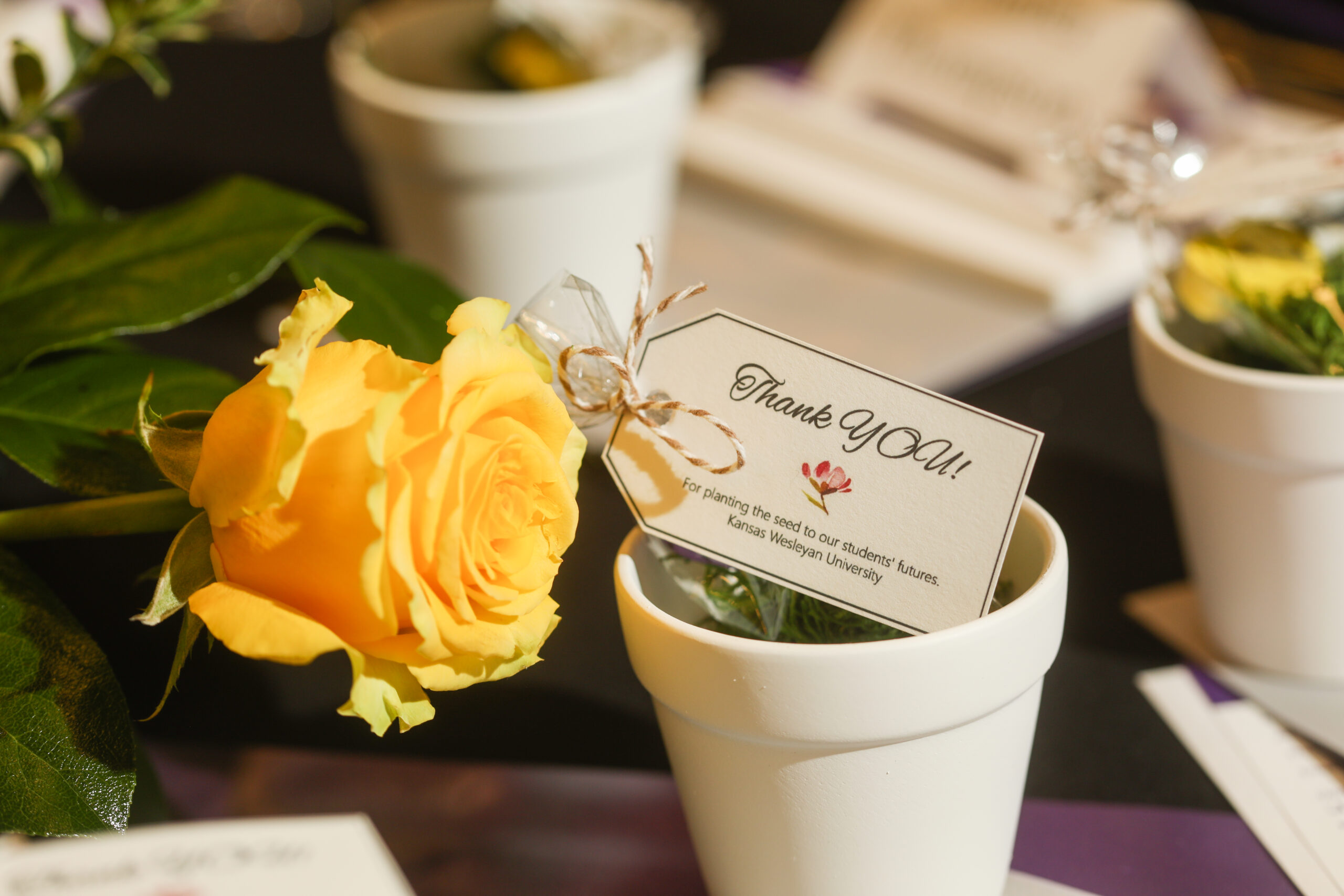 A decorative thank you tag on a table setting