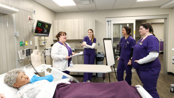 Nursing teacher giving instruction