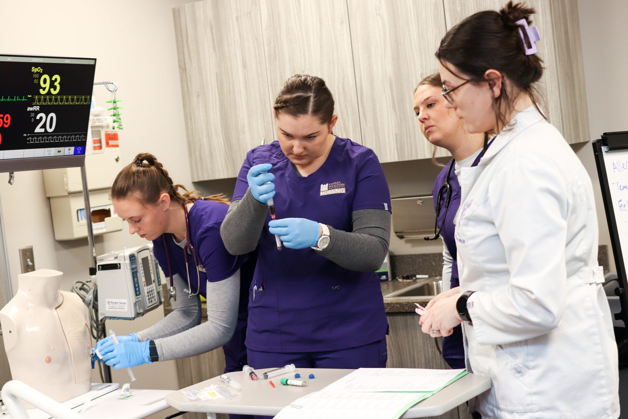 Nursing students performing simulated tests