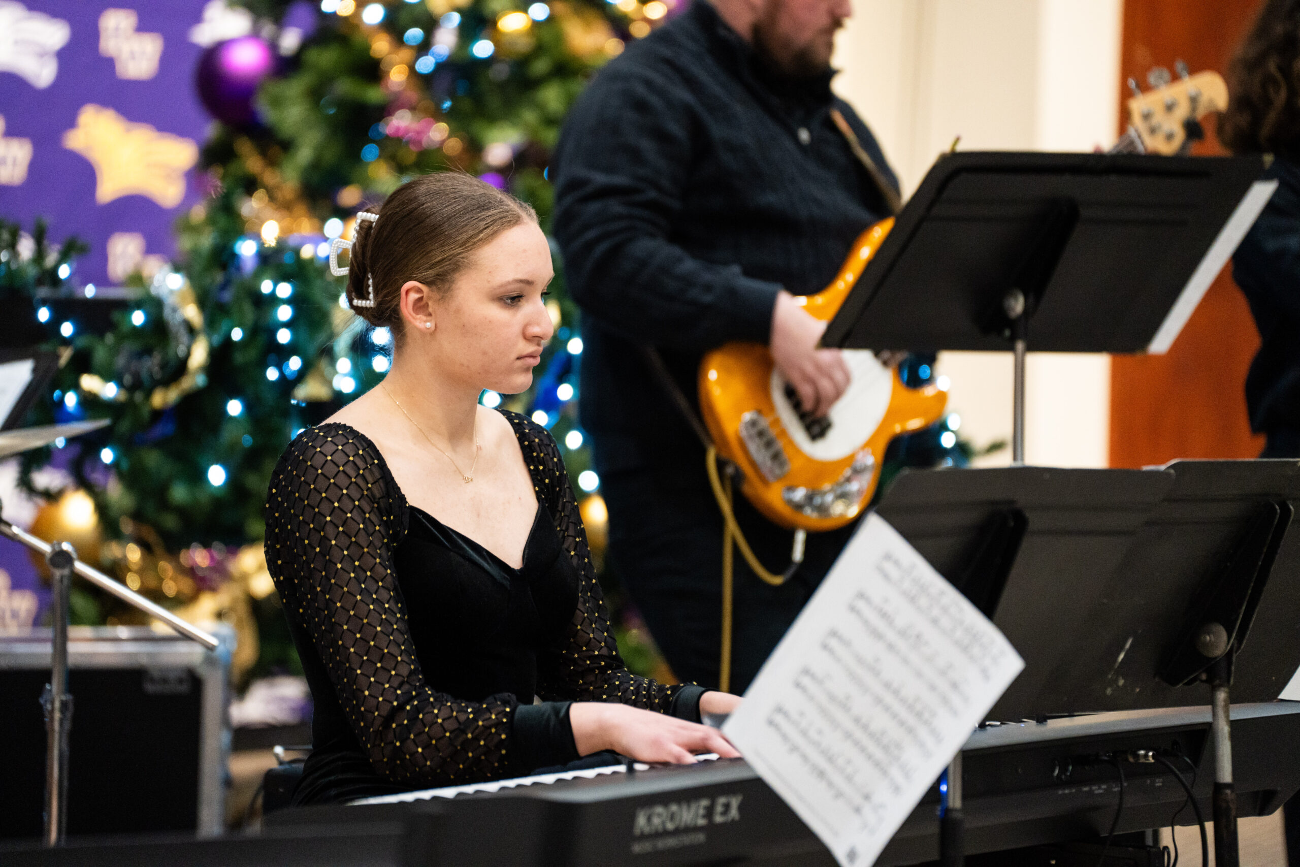 Young woman playing keyboard