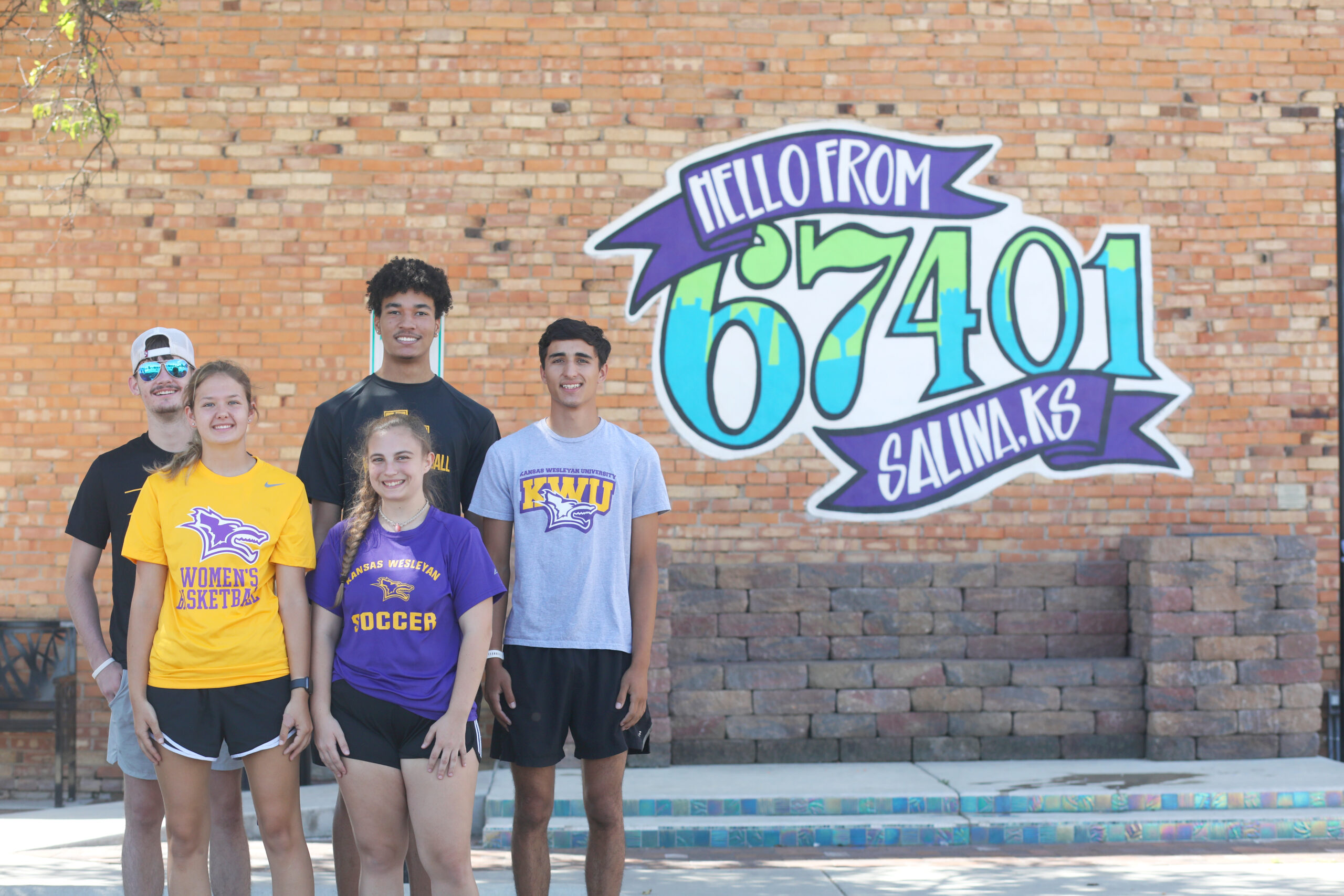 Students downtown by sign