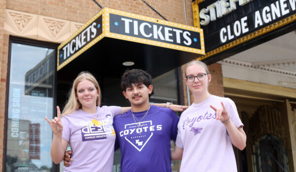 Students pose in front of Stiefel Theatre
