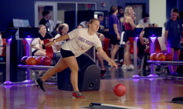 Students bowling at The Alley