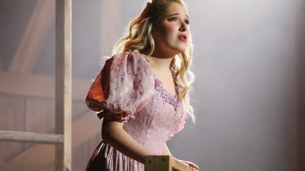 Student performing in musical