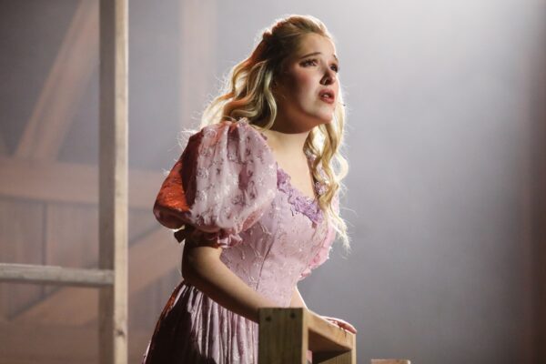 Student performing in musical