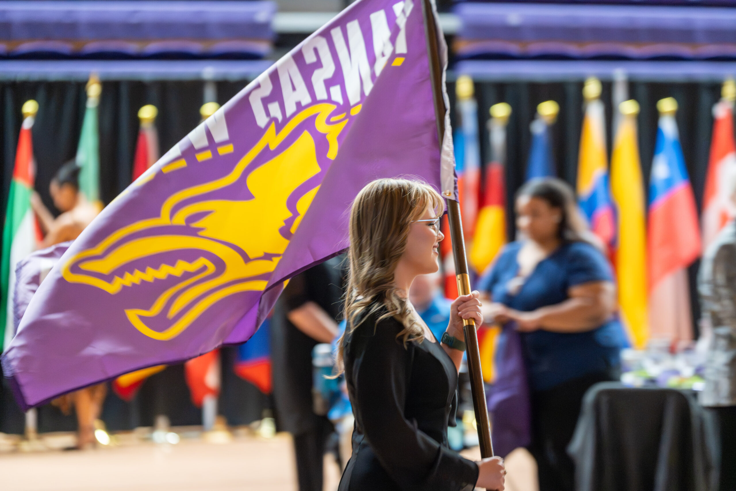 Woman holding KWU flag