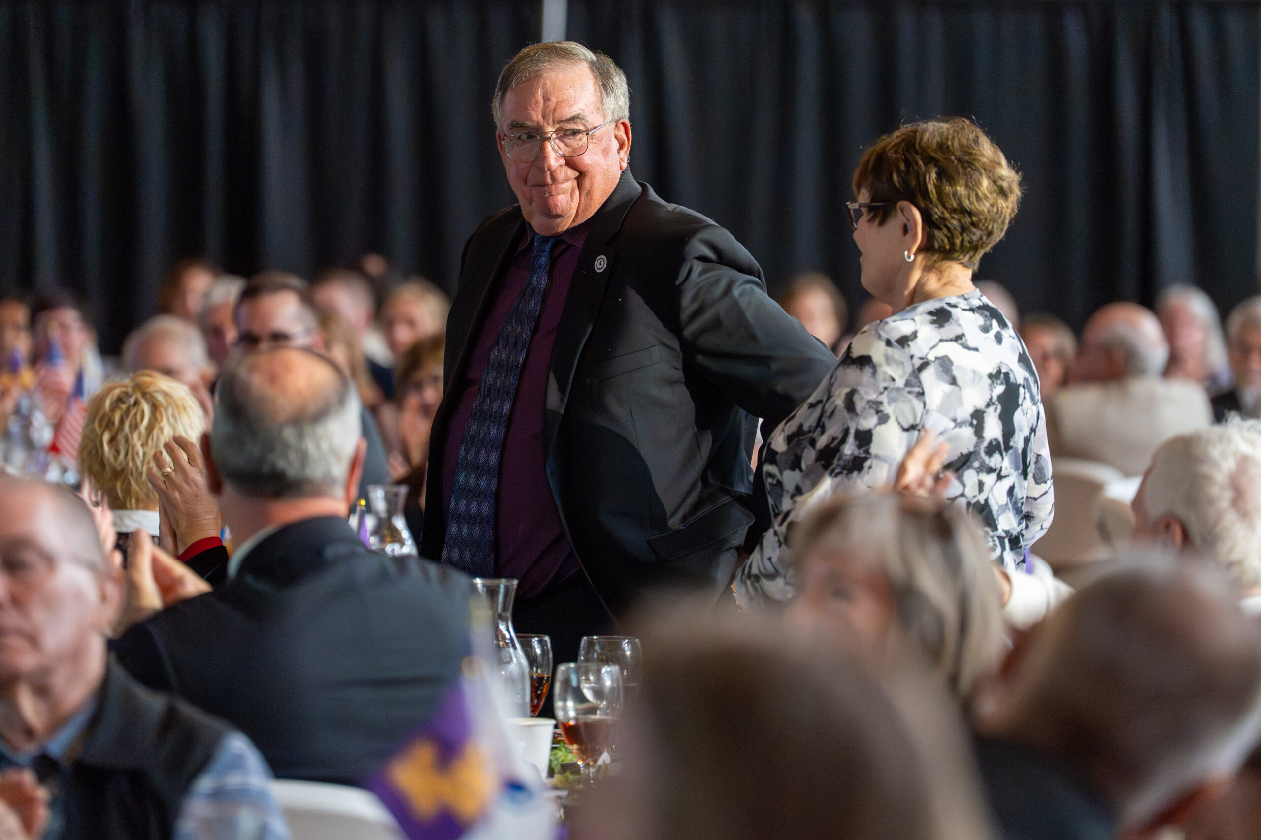 Older couple being recognized