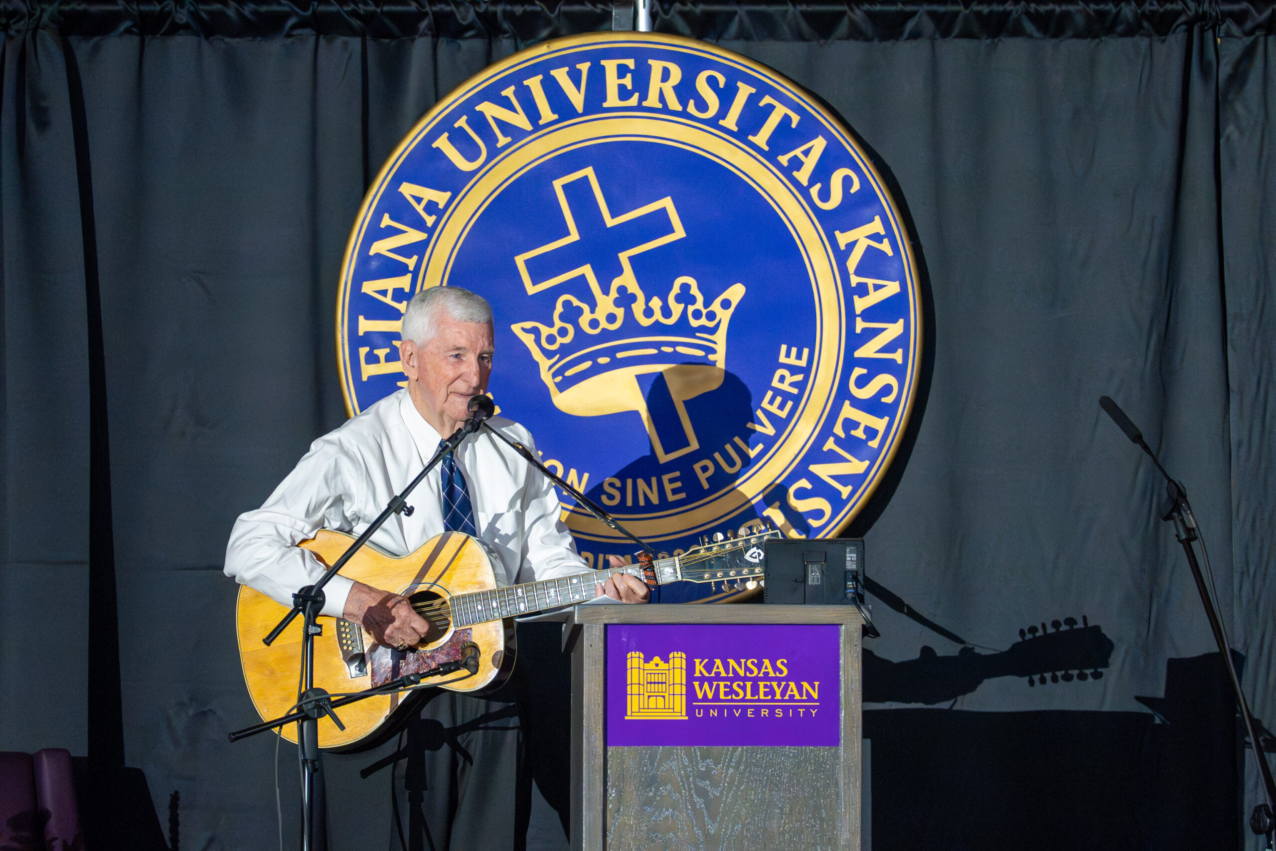 Older man playing guitar