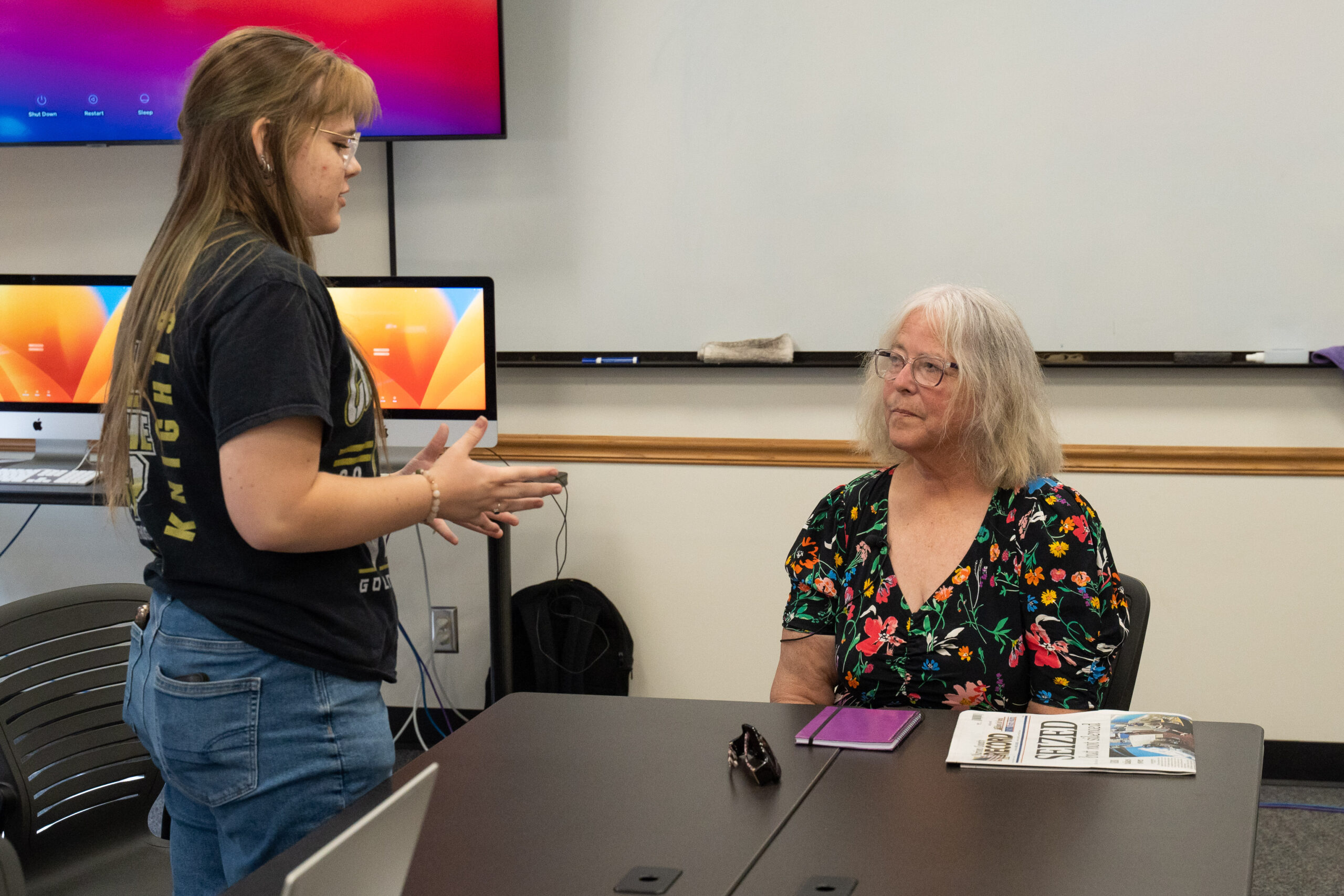 Student talking to speaker