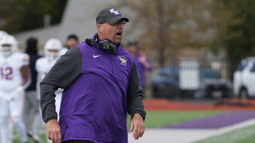 Man on sidelines of football game