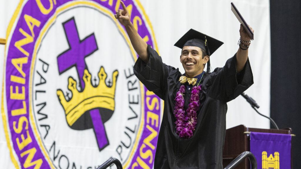 Man celebrating after getting diploma