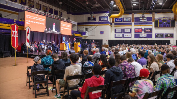 Wide angle shot of large audience in Mabee Arena
