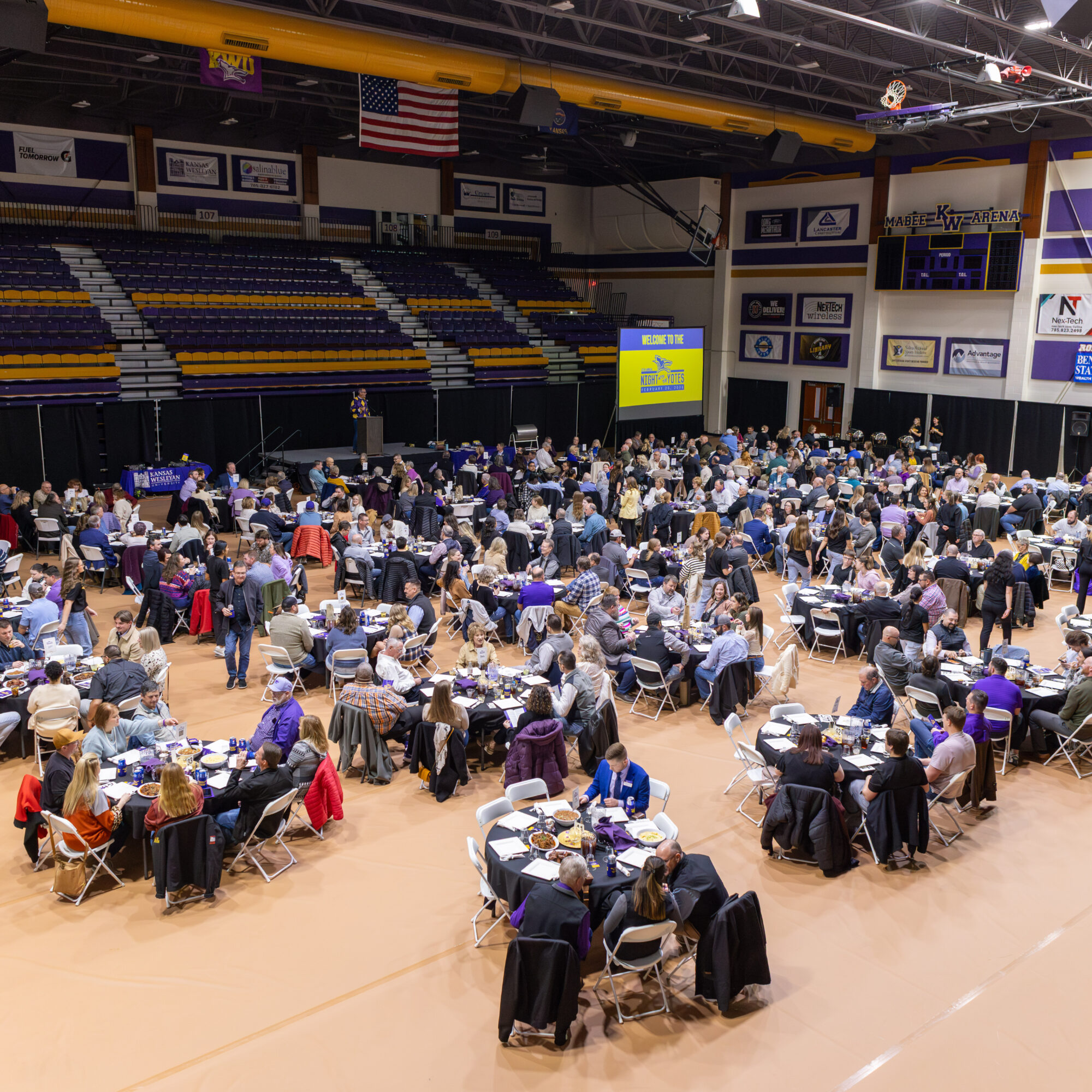 Wide angle shot of Mabee Arena filled with people