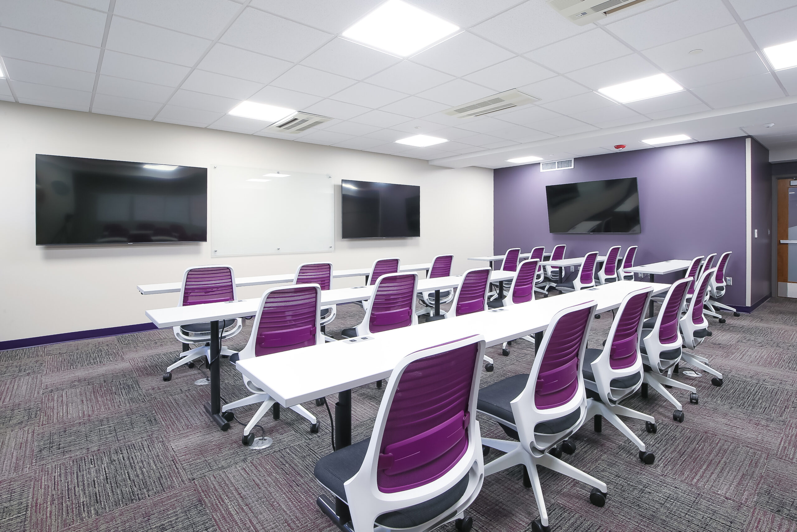 Lecture room with chairs and monitors