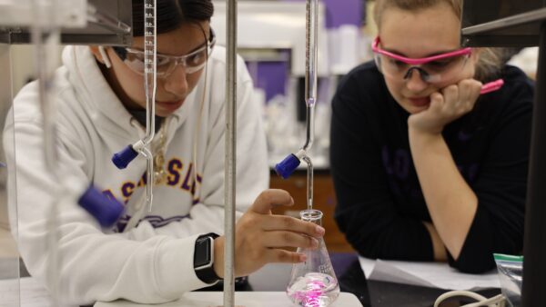 Students conducting chemistry experiment