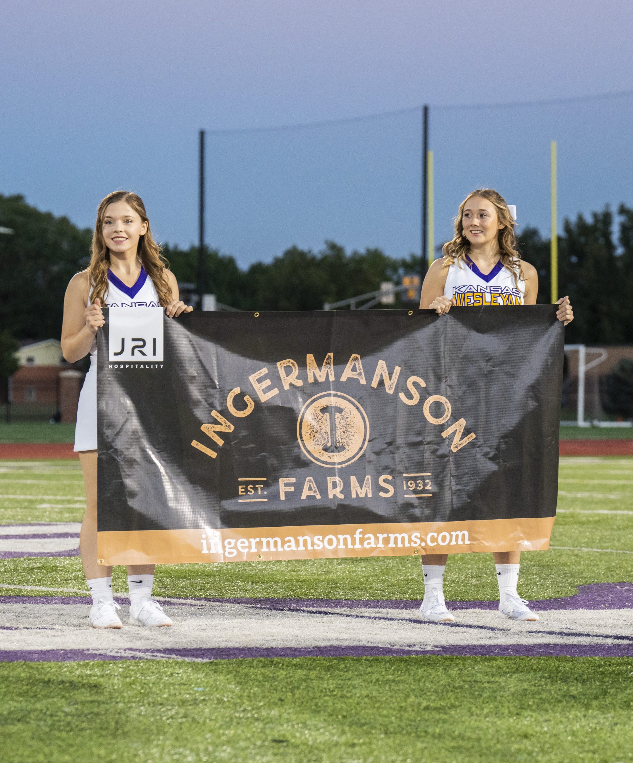 Cheerleaders holding banner