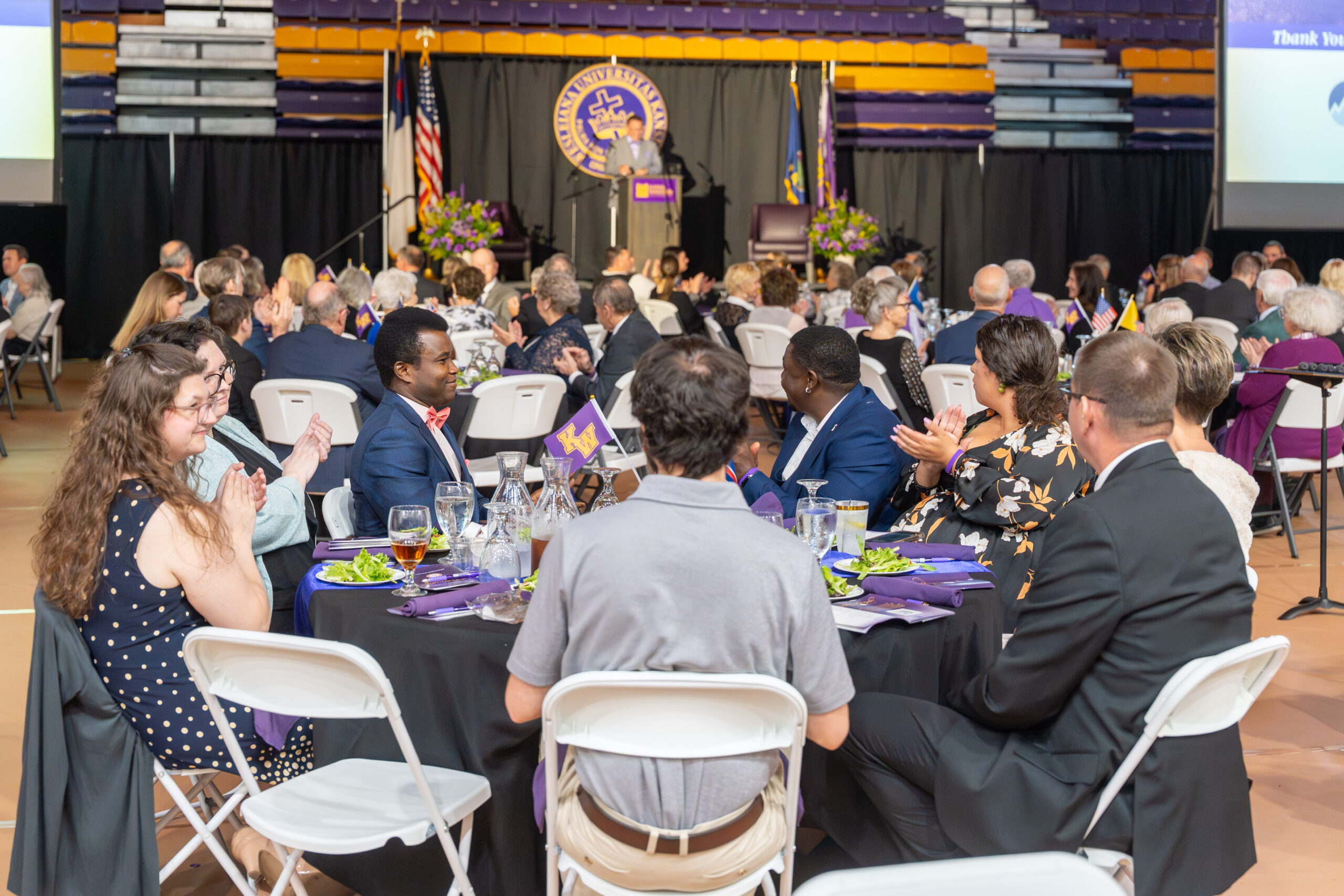 People sitting at tables during scholarship gala