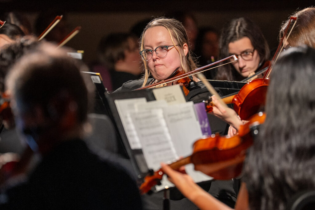 Woman playing stringed instrument