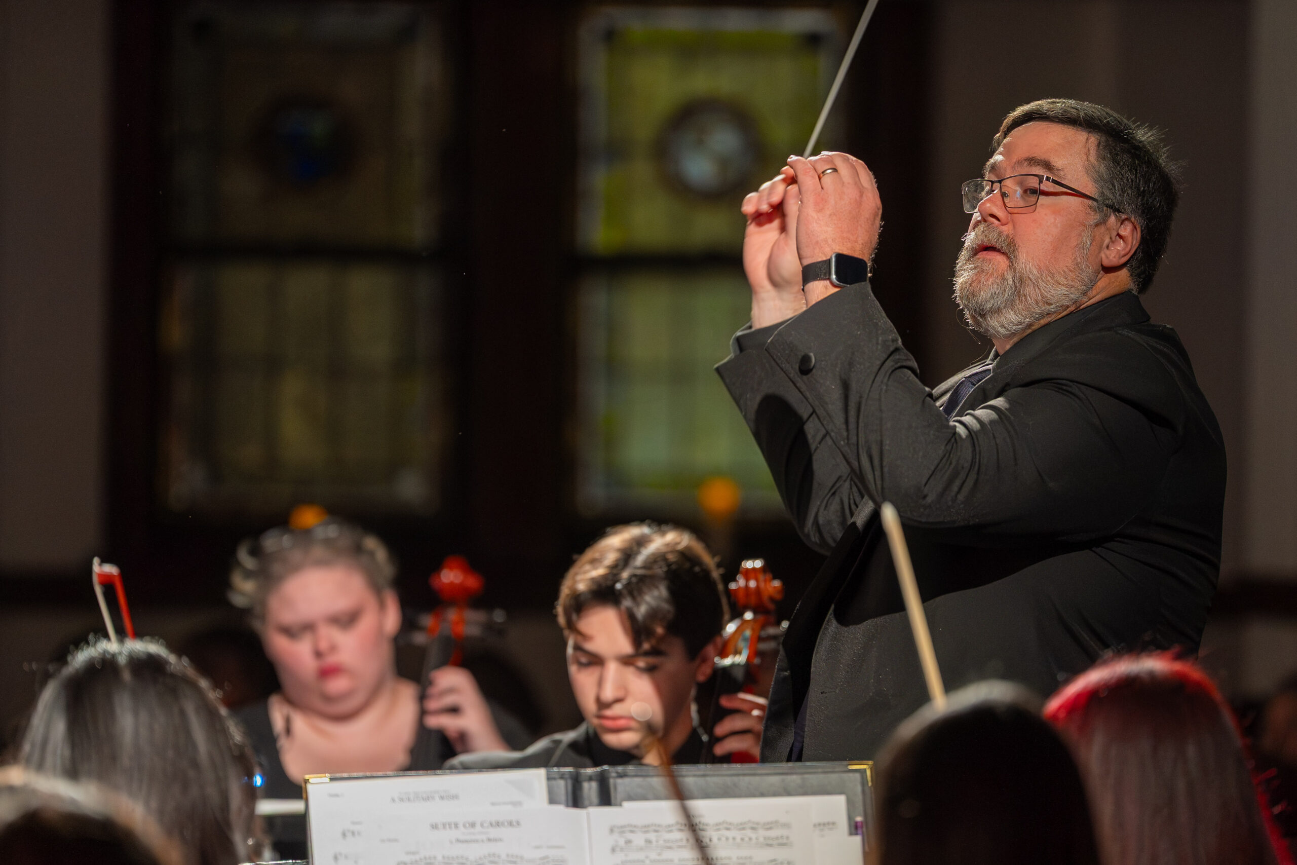Conductor during Christmas by Candlelight Service