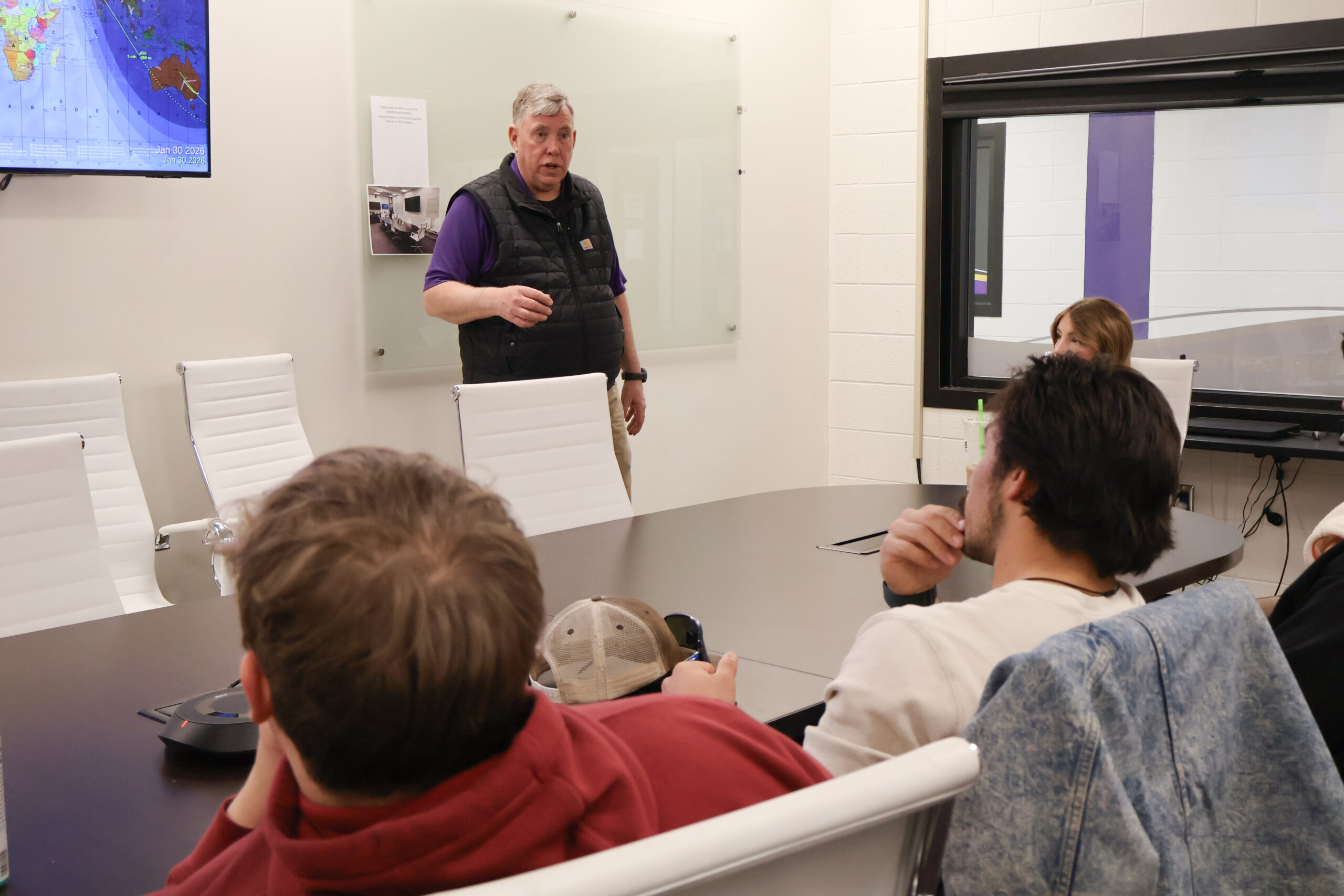 Instructor speaking to students in EOC