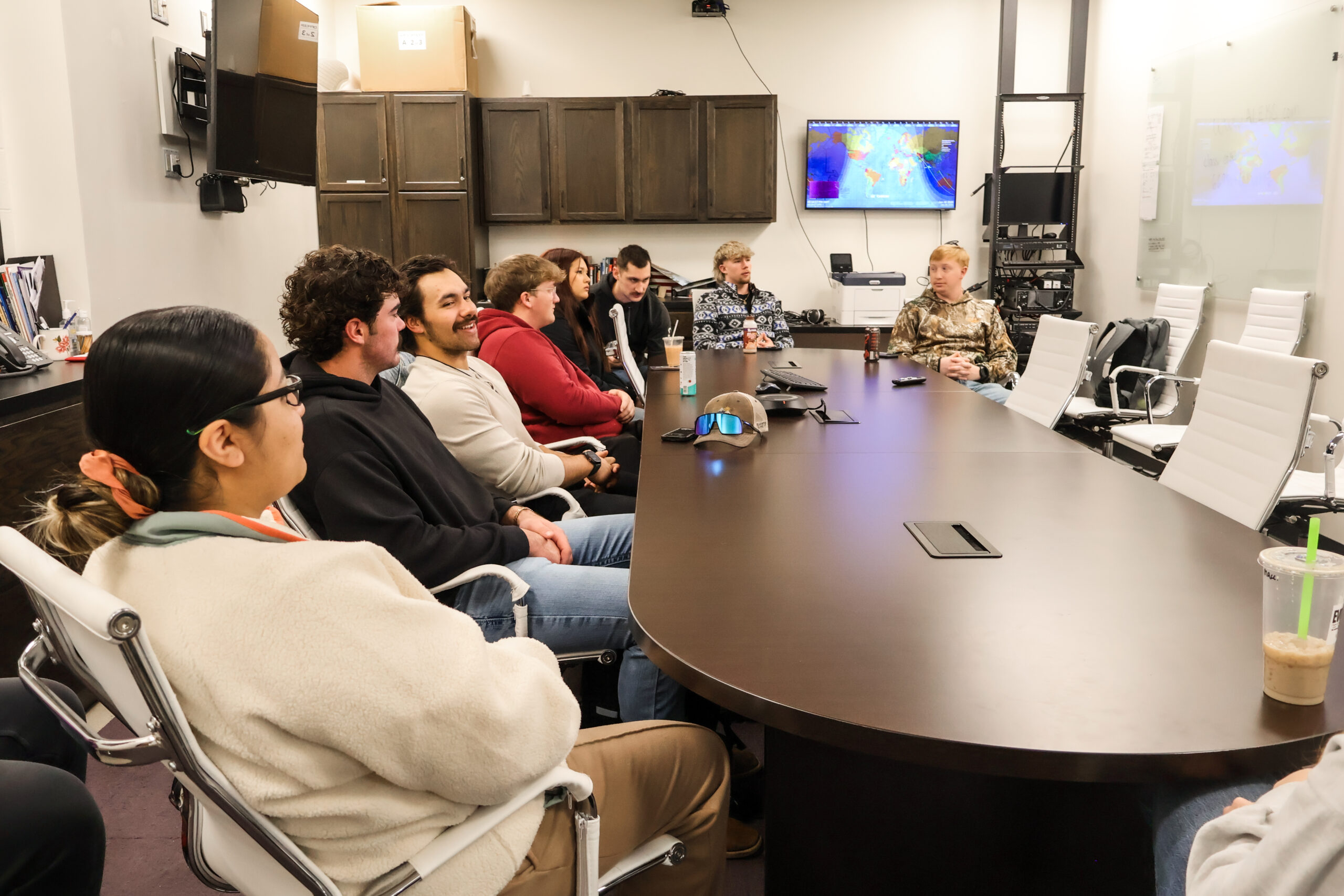 Students gathered around table in EOC