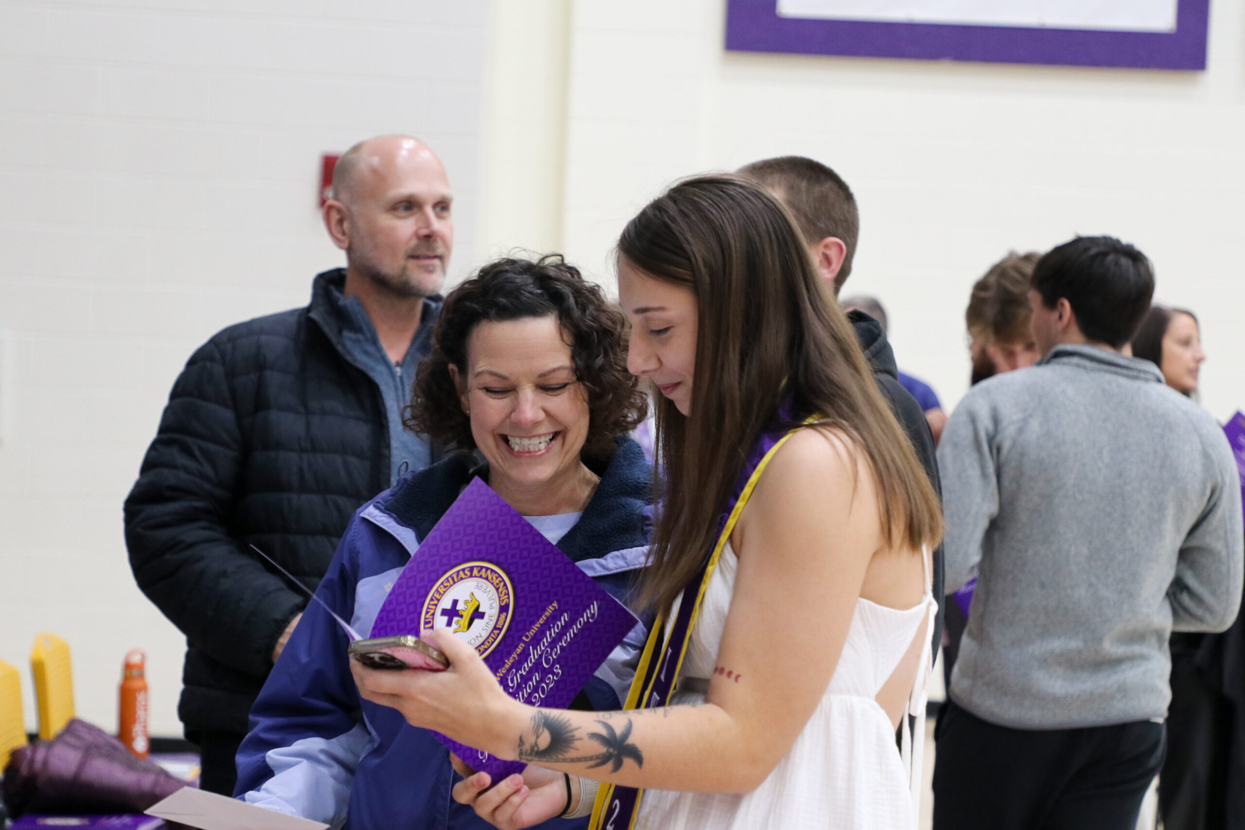 Two women speaking at Fall Graduation