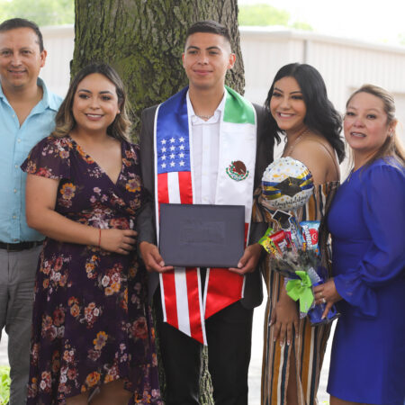 KWU student with family at graduation