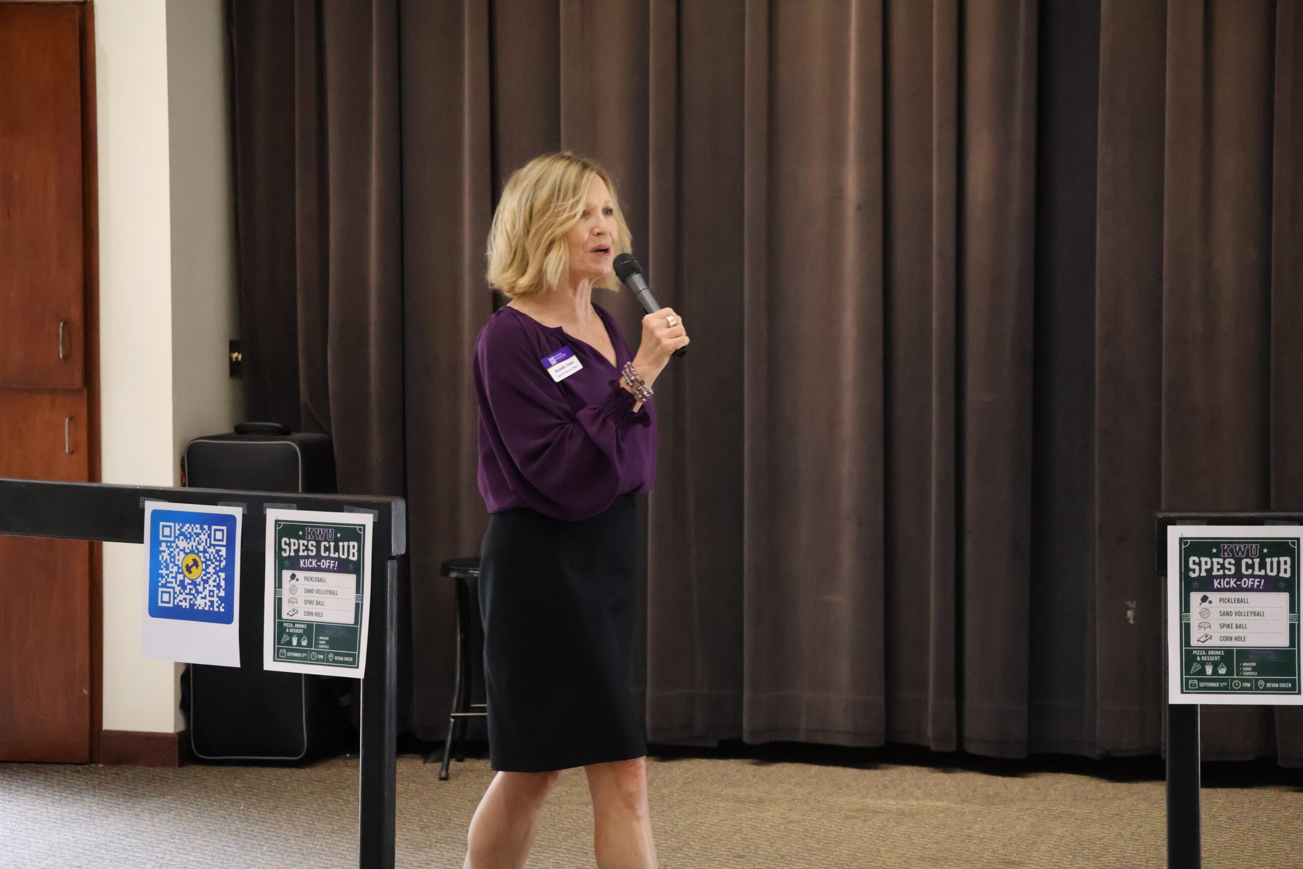 Woman speaking on stage