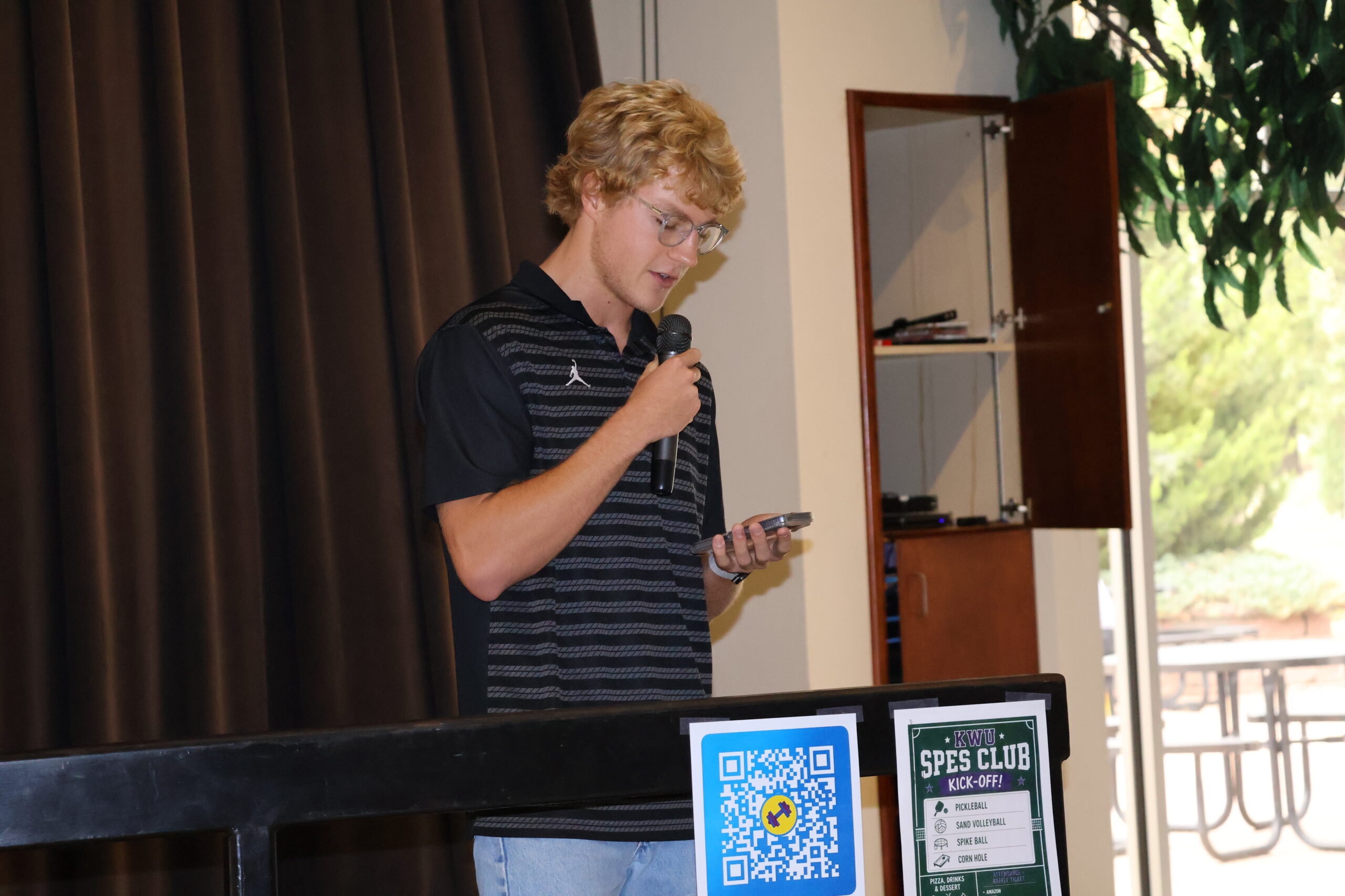 Man reading on stage